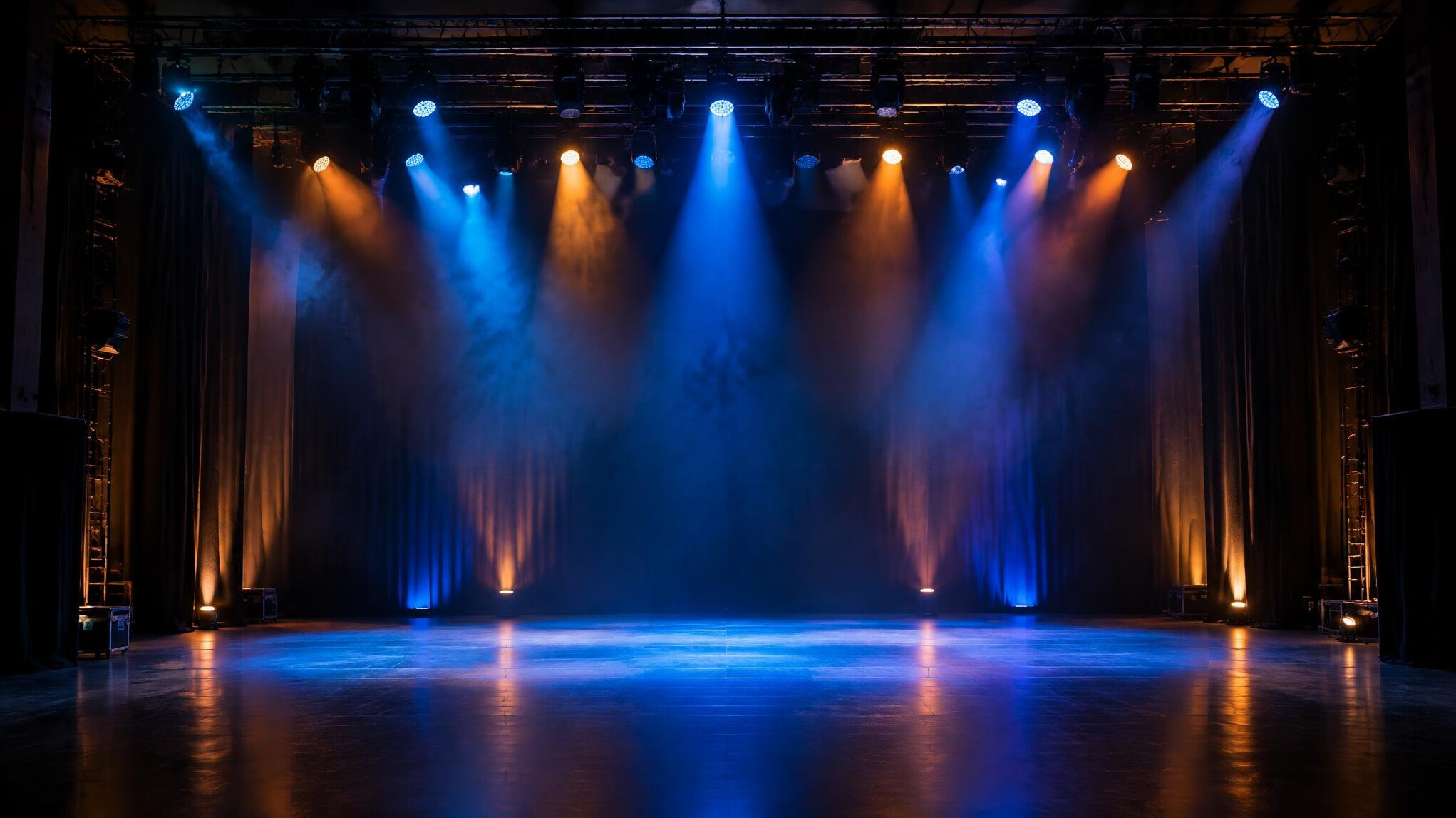 Stage lit with dramatic coloured lighting during a live production